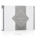 Fitted jersey mattress protector with gray logo panel and stitched border, white/gray