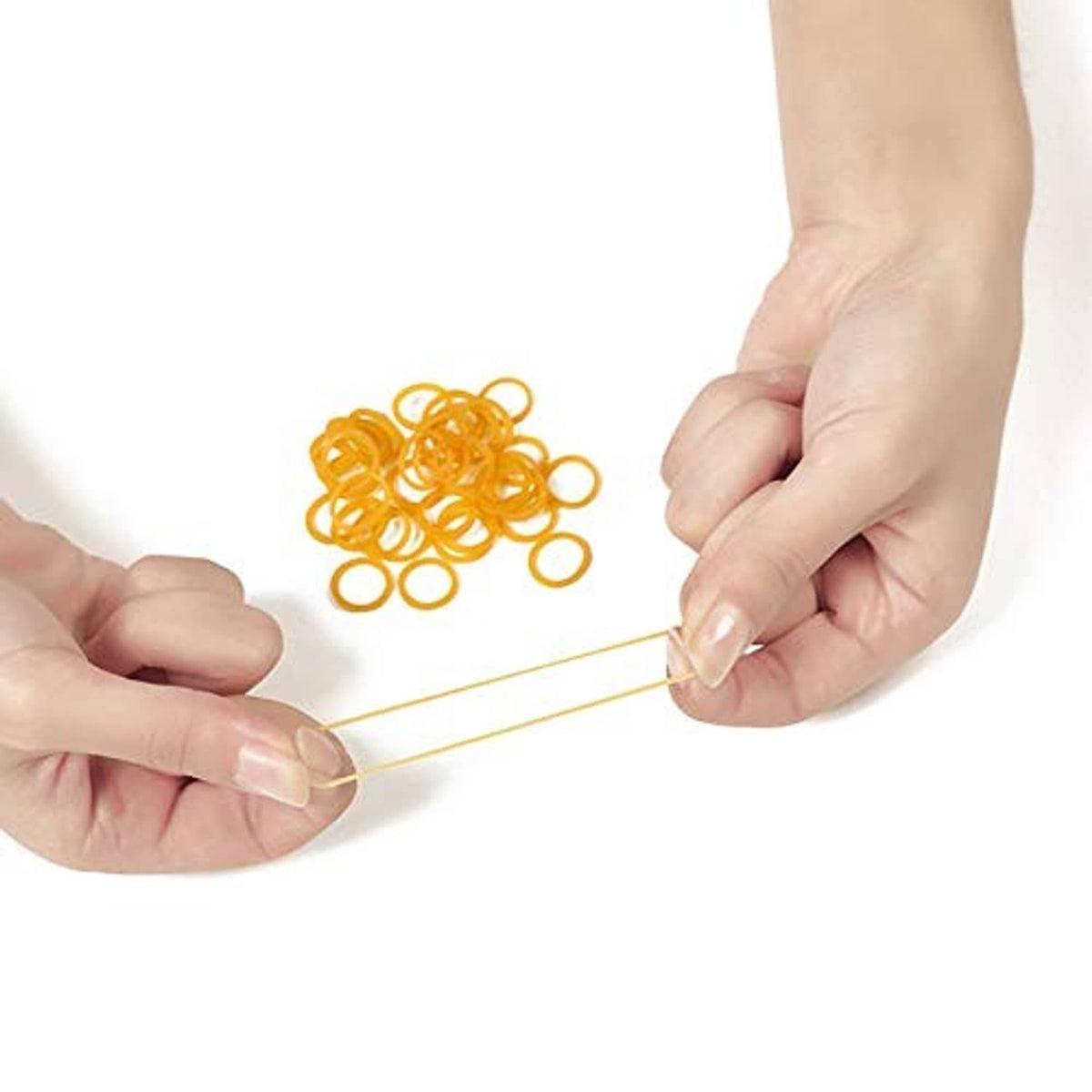 Yellow mini rubber bands in hands, one band being stretched