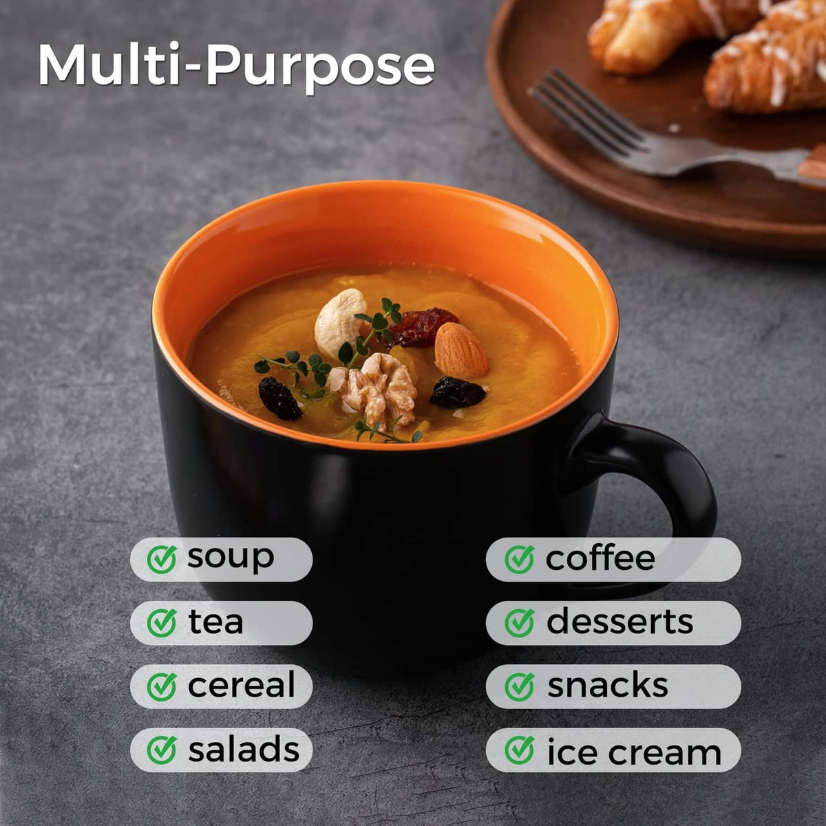 Black soup mug with handle filled with light broth and meat-and-raisin toppings