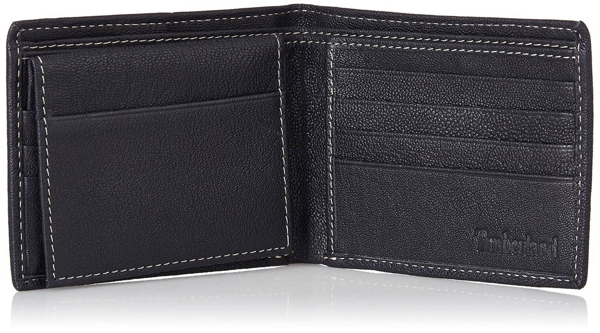 Navy leather bifold wallet interior with card compartments and embossed Timberland logo.