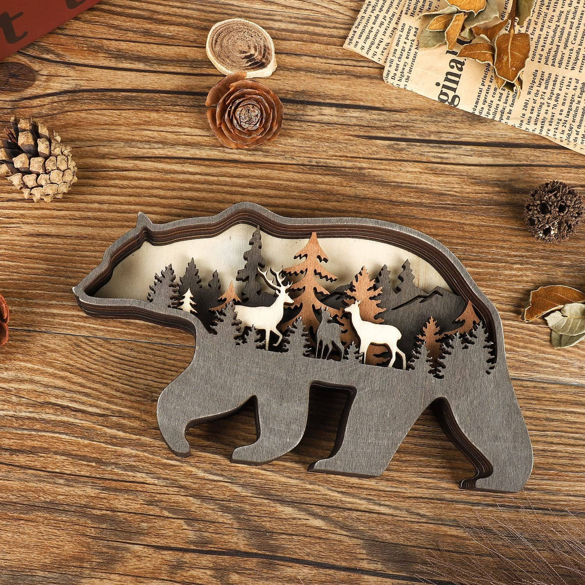 Wooden bear decor with detailed forest silhouette cutouts on wood tabletop
