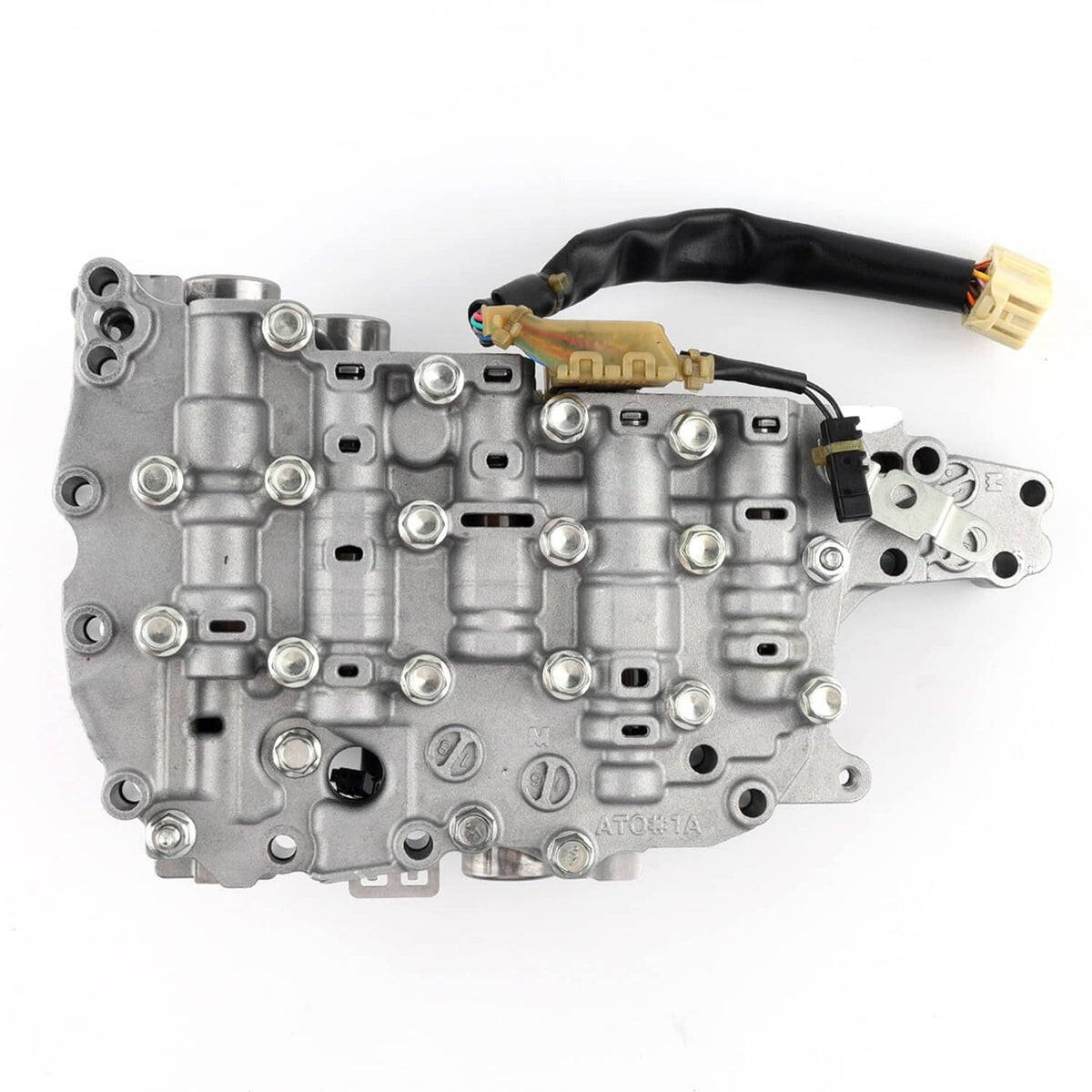 Transmission valve body with solenoid components and electrical connectors, silver-gray metal housing.