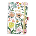 Pocket monthly planner with floral cover, gold elastic strap, and ribbon bookmark, 27-29