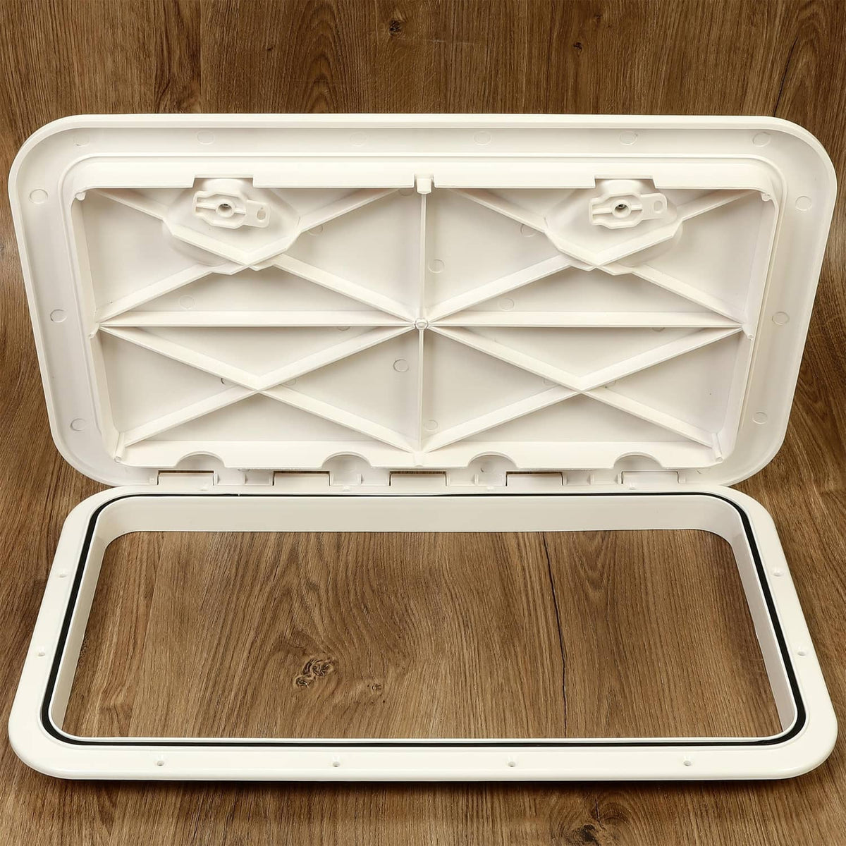 White deck hatch lid open with ribbed inner panel and empty opening frame