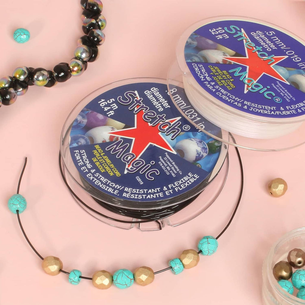 Stretch Magic clear elastic cord spool with bead strands and finished bracelets