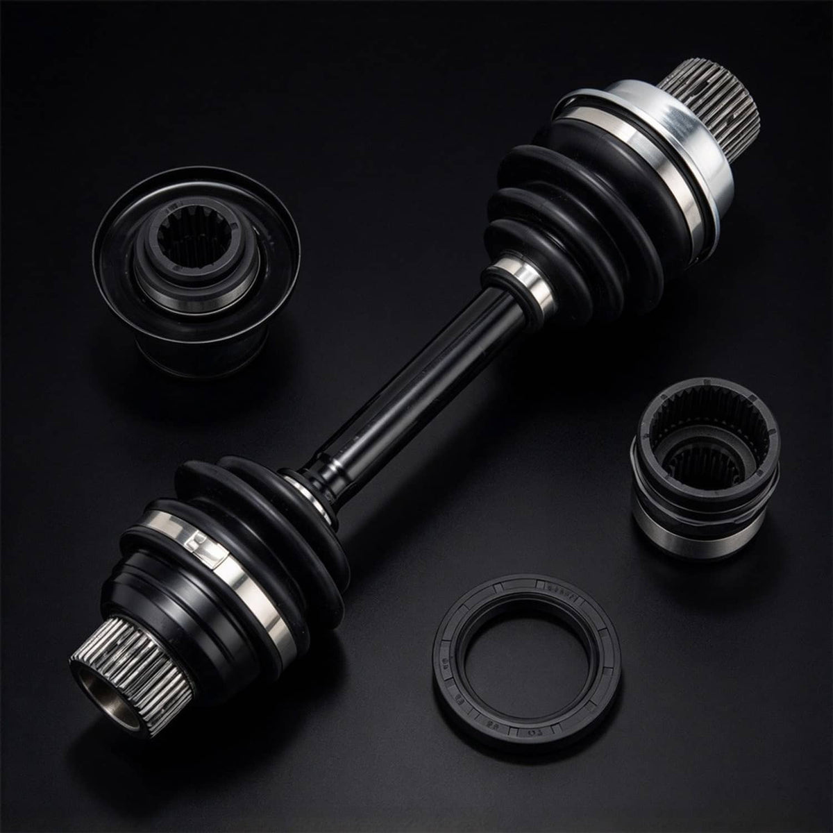Front differential drive shaft coupler set with black boots and splined joints