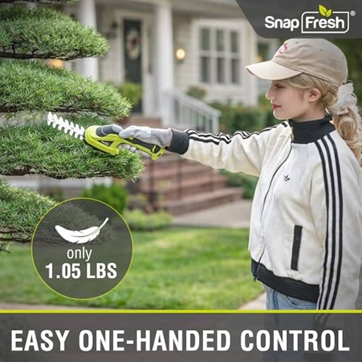Person using a lime green hedge trimmer to trim an outdoor hedge in a yard.