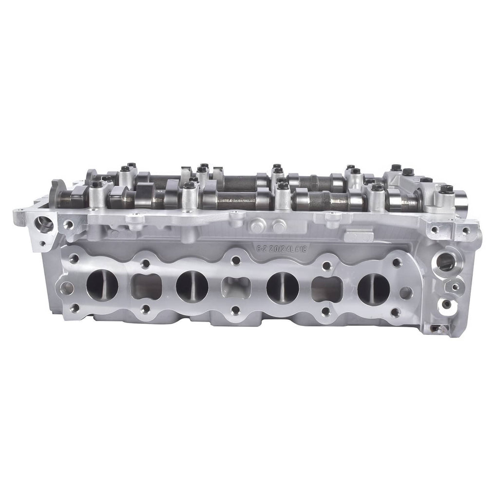 Aluminum cylinder head with rocker area and long row of exhaust valve ports.