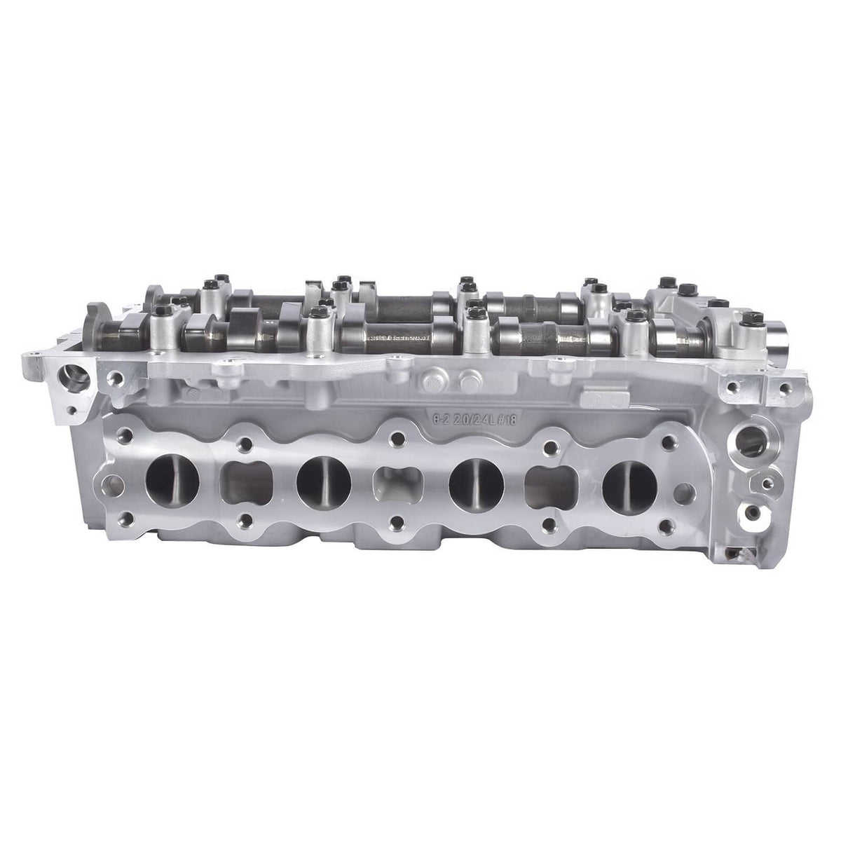 Aluminum cylinder head with rocker area and long row of exhaust valve ports.