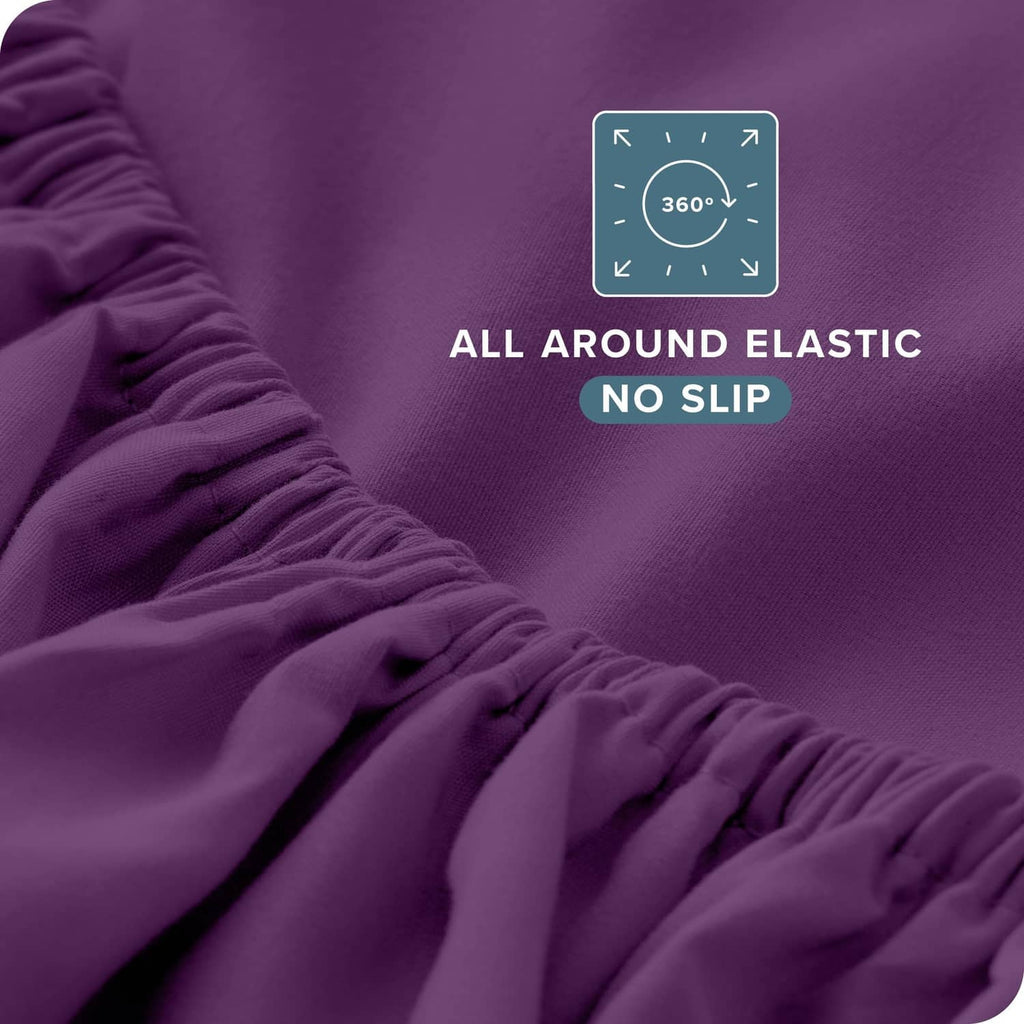 Plum fitted sheet close-up with elasticated all-around edge