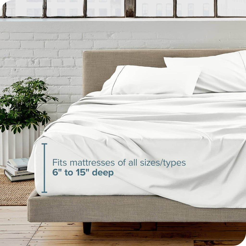 Cream bed sheet set on a mattress with deep-pocket fit over the mattress edge