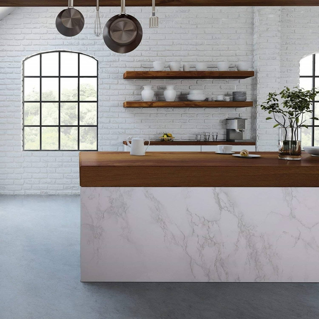 Glossy white marble contact paper wrapping a kitchen island counter with mottled veining