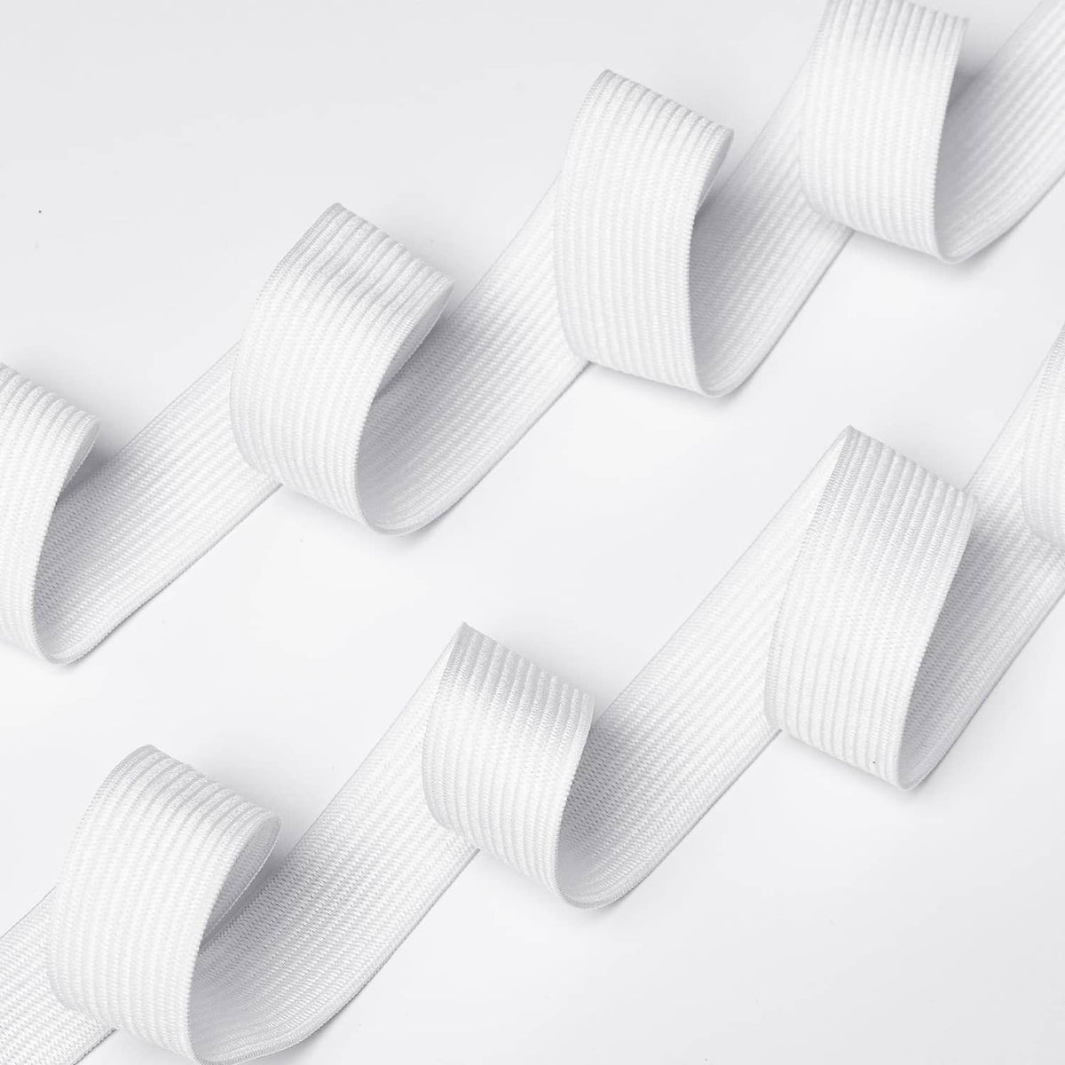 White 3/4 inch sewing elastic band folded into multiple loops