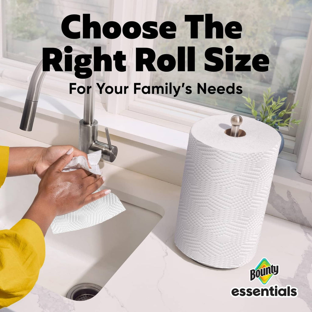 White paper towel roll dispensing from a kitchen counterholder