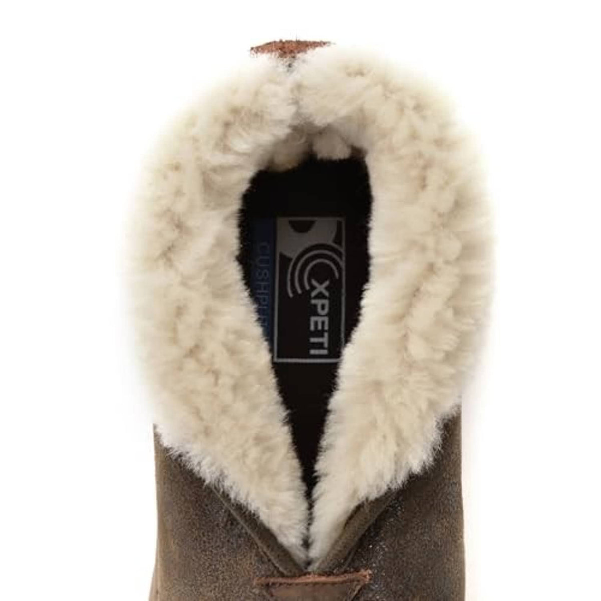 Shearling-lined boot interior with XPETI label tag