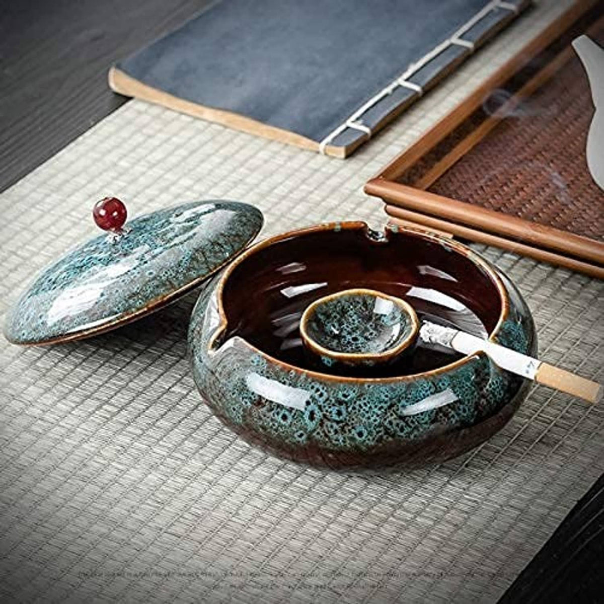 Turquoise ceramic windproof ashtray with lid, open with brown inner tray and rim