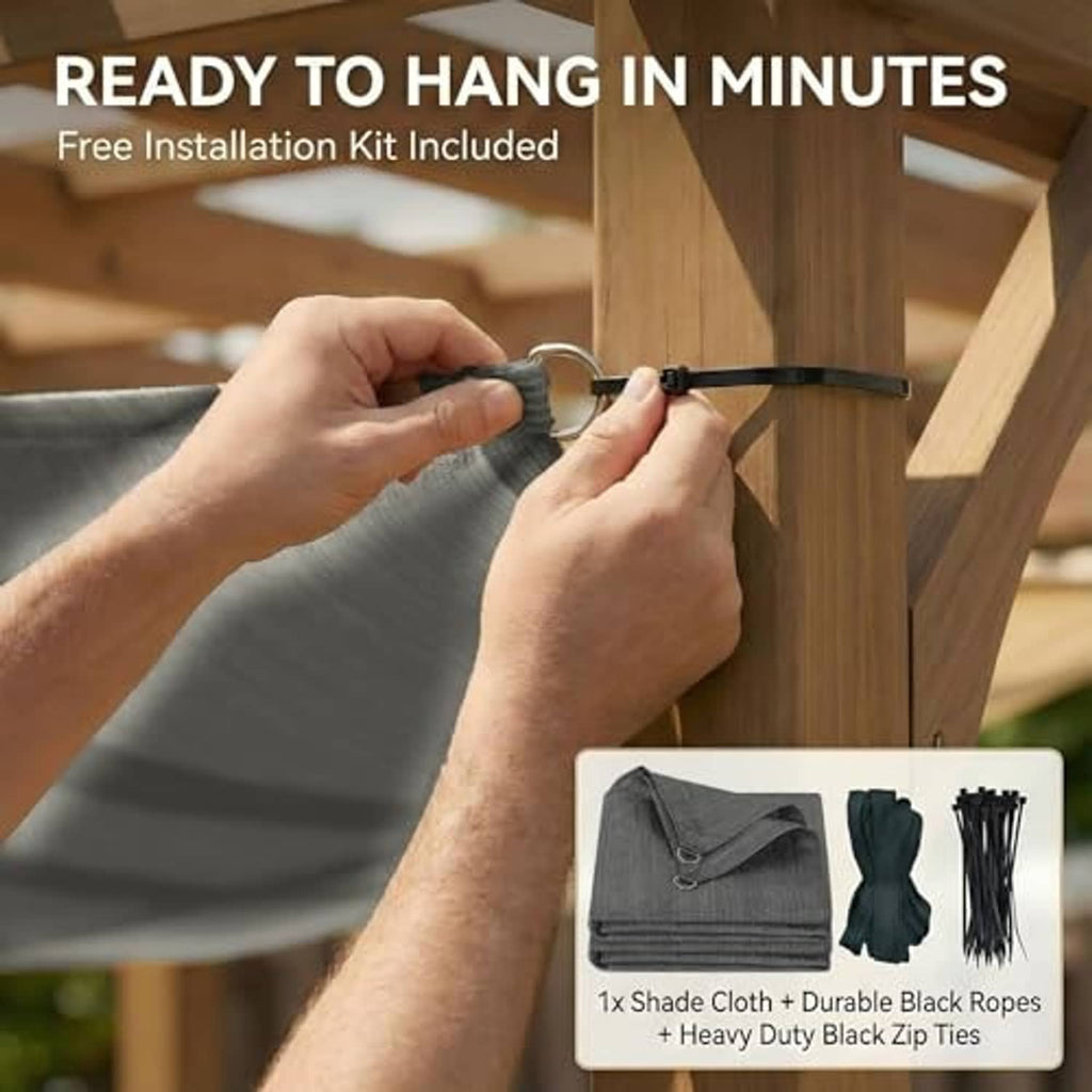 Gray sun shade cloth being attached to outdoor posts with a metal D-ring and strap