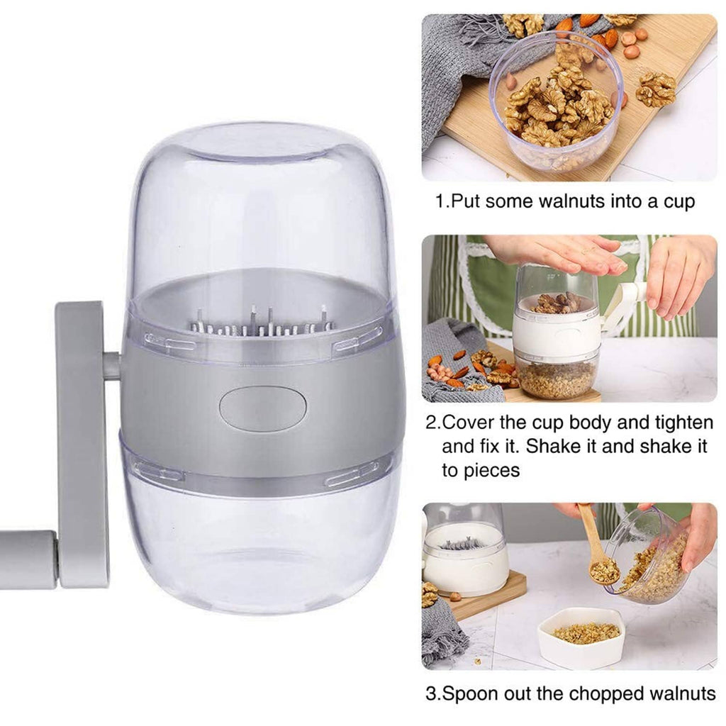 White portable nut chopper with clear cup and visible metal grinder spikes