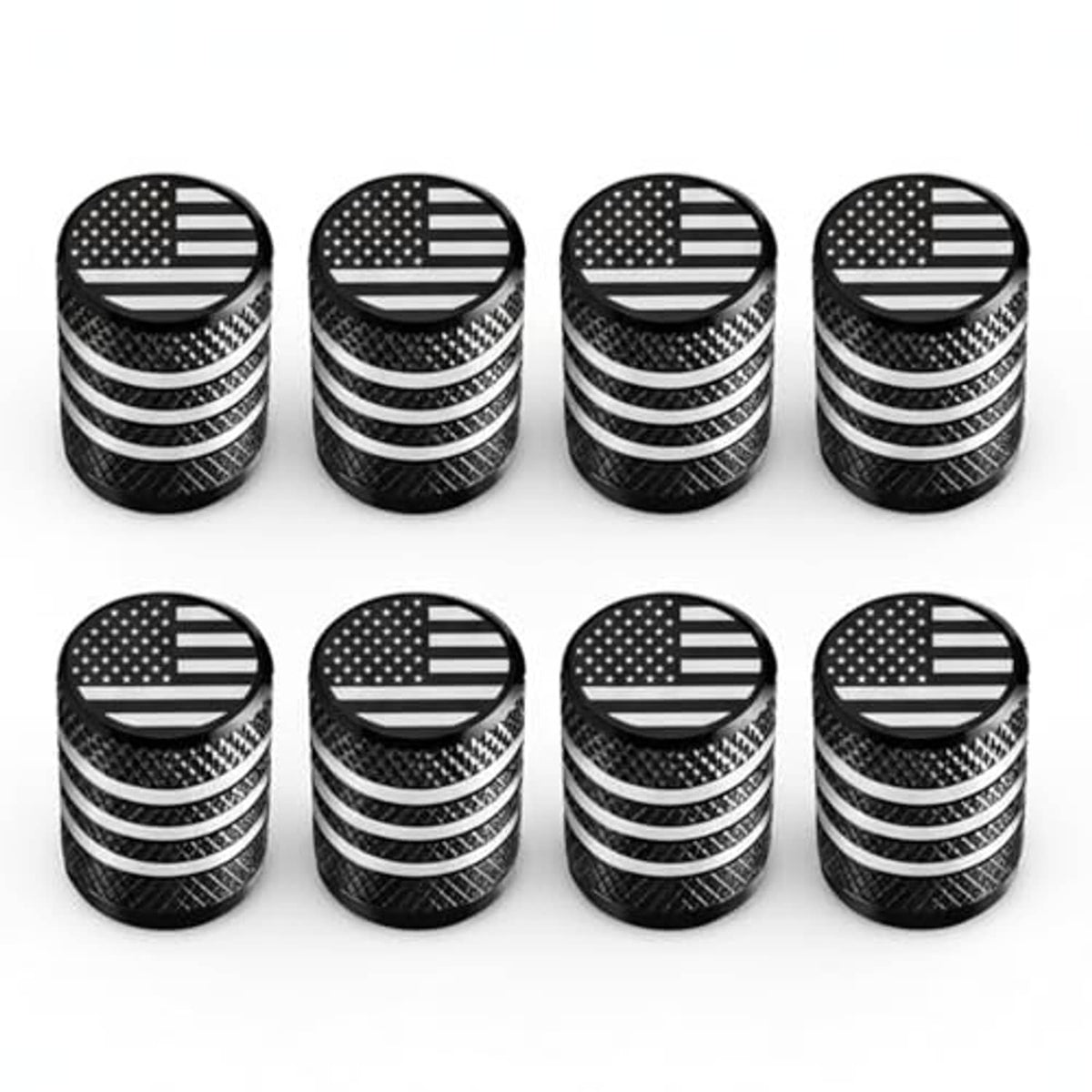 Set of 8 tire valve stem caps, black textured bodies with engraved U.S. flag top discs.