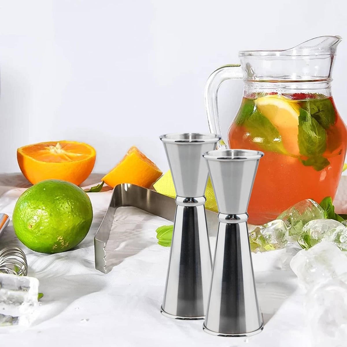 Stainless steel jigger cups, including a two-piece set