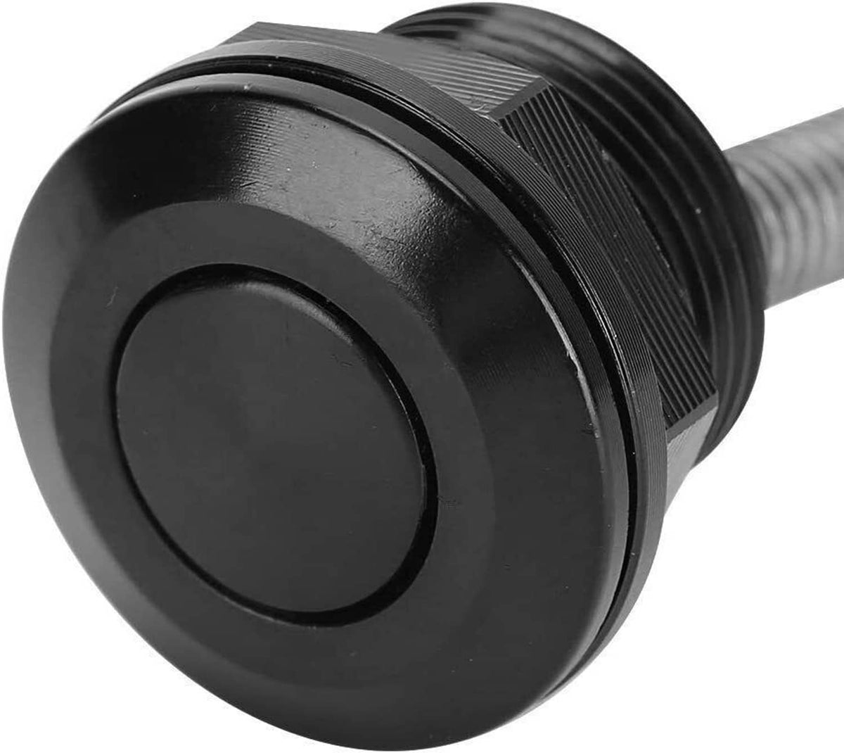 Close-up of black round push-button hood latch head on threaded stud