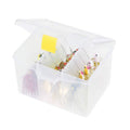 Clear plastic stowaway spinner bait box, open with lure compartments and hooks