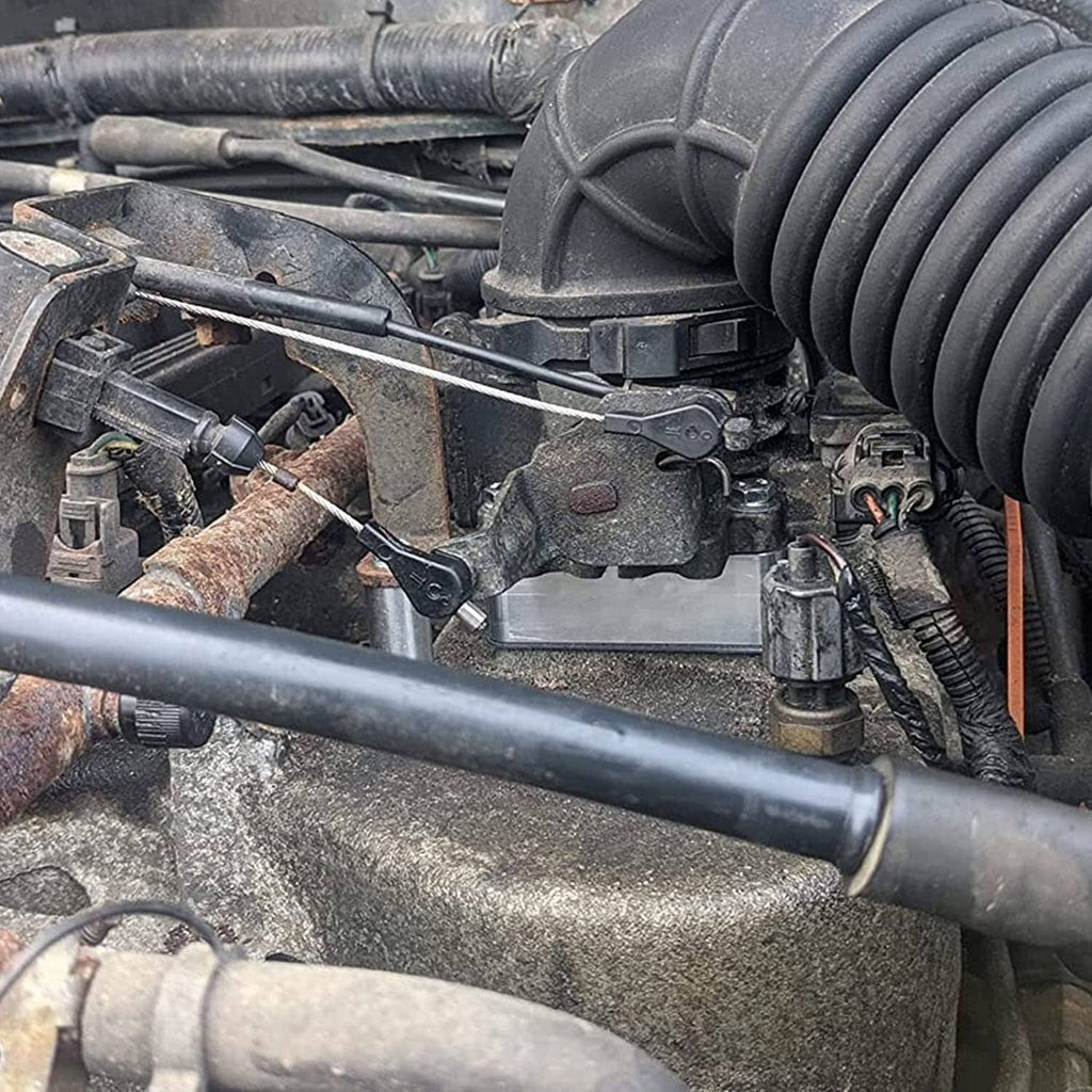 4-bolt throttle body spacer installed in engine bay near intake hose