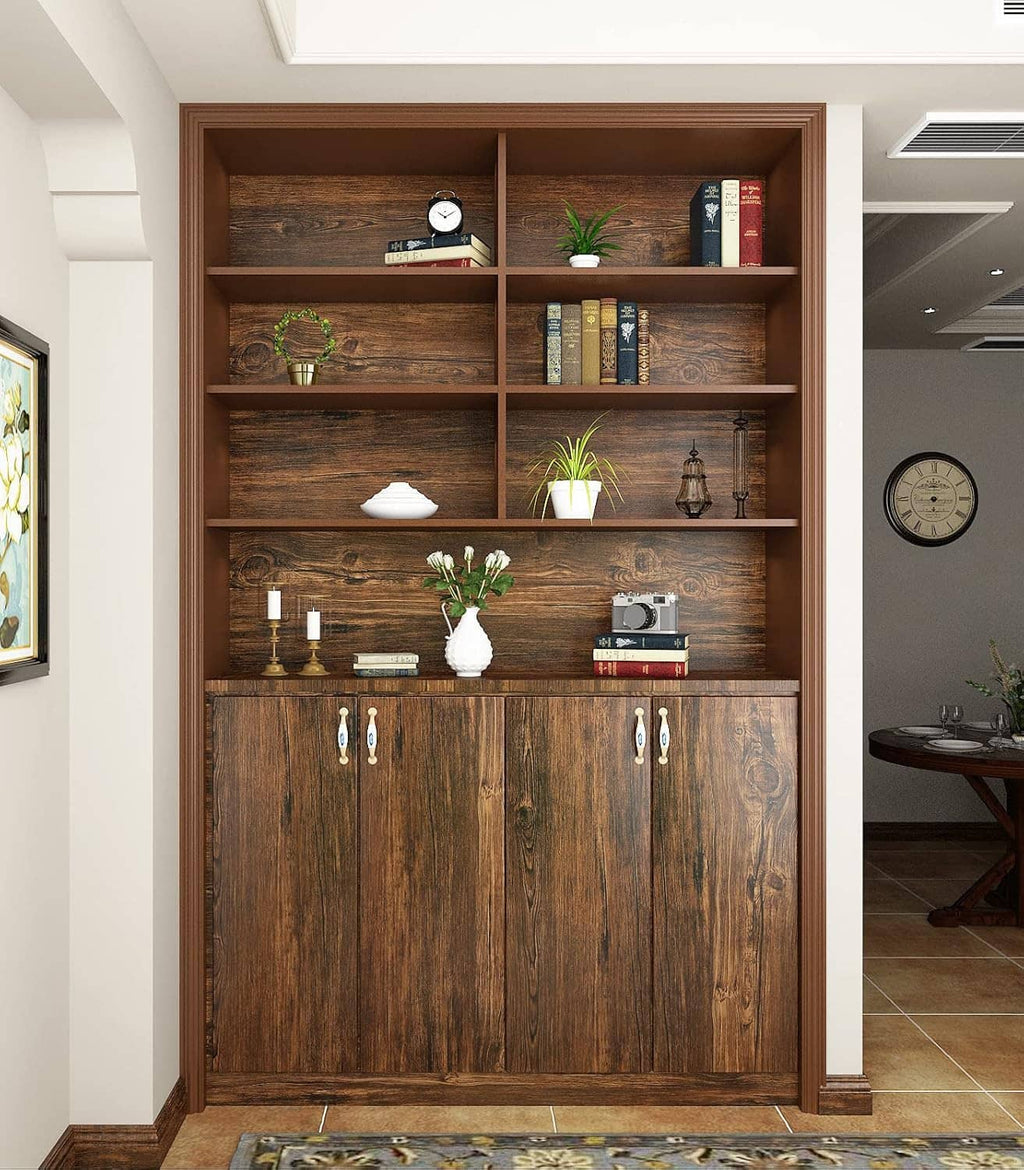 Brown faux wood cabinet doors with metal pulls and shelves in a built-in unit