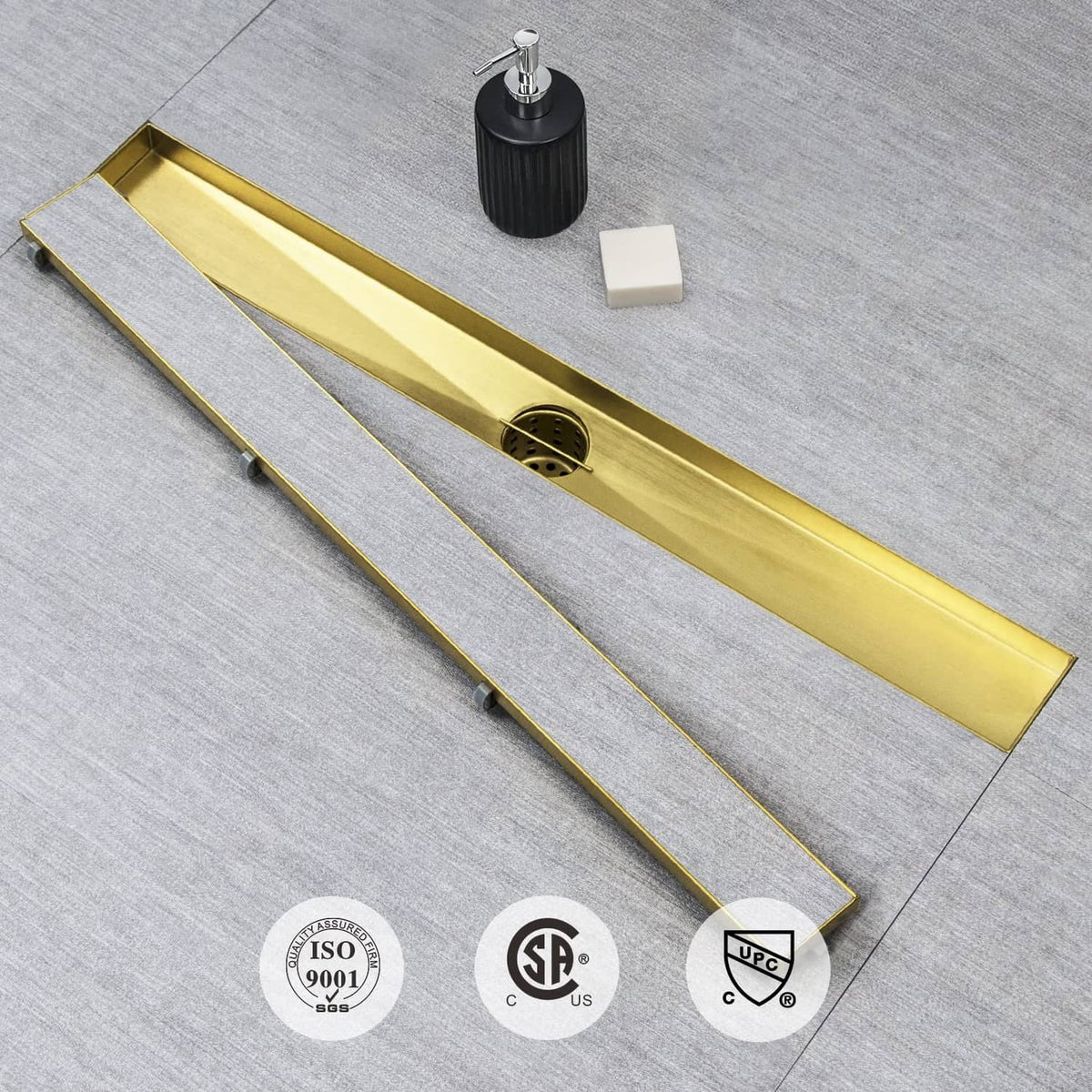 Gold linear shower drain grate with hair strainer opening and mounting parts underneath
