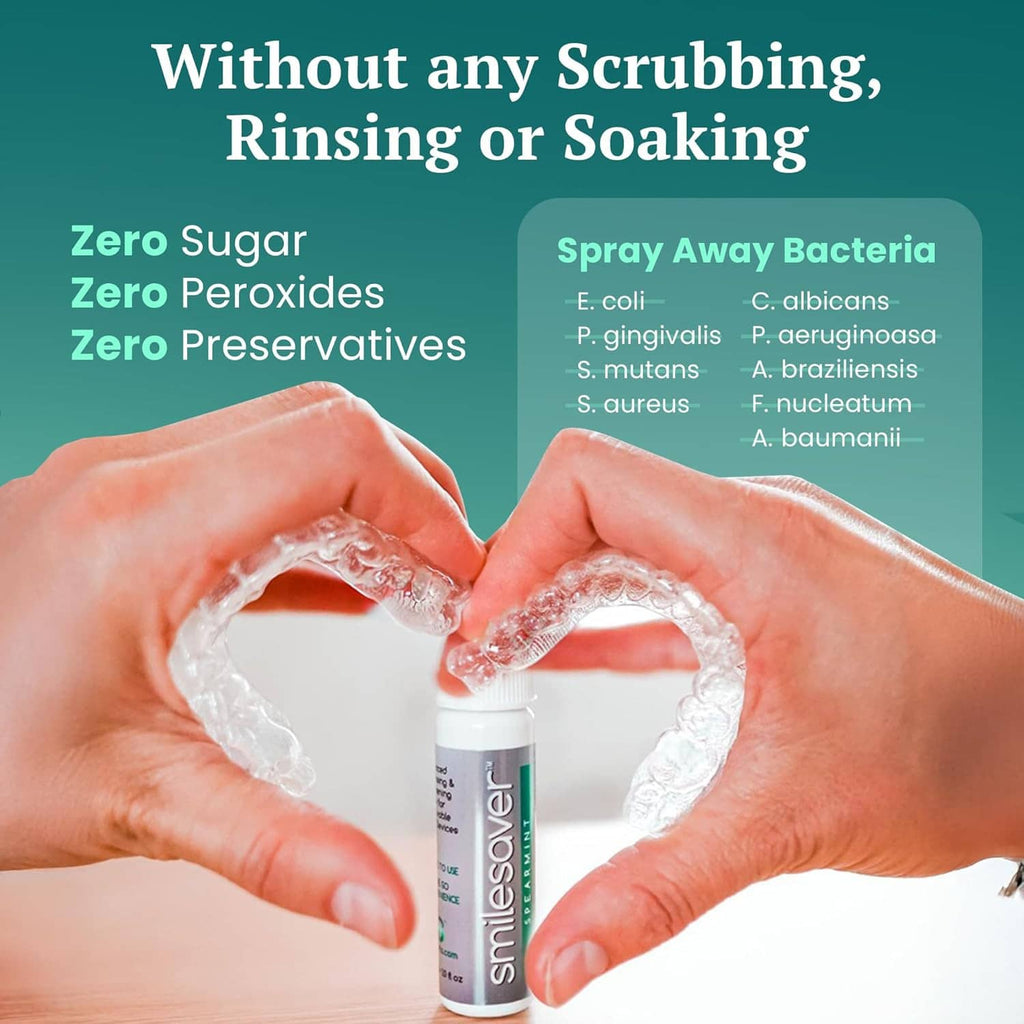 Smilesaver spray cleaner bottle between hands forming a heart with foam