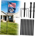 Black in-ground flag pole kit with mounting stakes and pole sections, designed for two flags