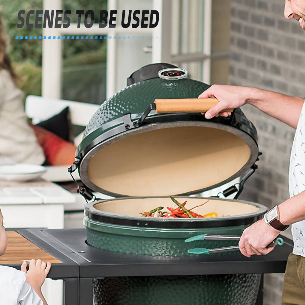 Circular grill thermometer dial on green egg-style cooker lid during cooking