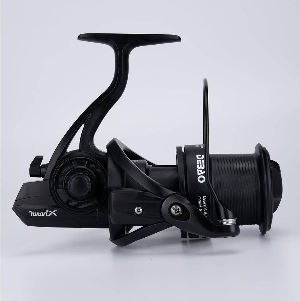 Black spinning fishing reel side view with long handle arm and ribbed spool
