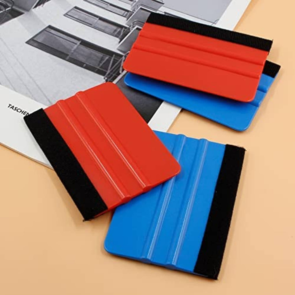 Red and blue felt edge squeegee tools stacked, each with black felt edge pad.