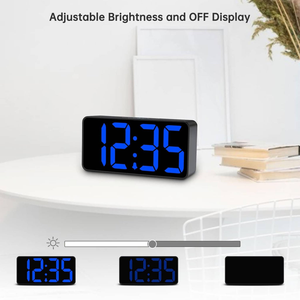 Bedside digital alarm clock showing large blue LED time digits