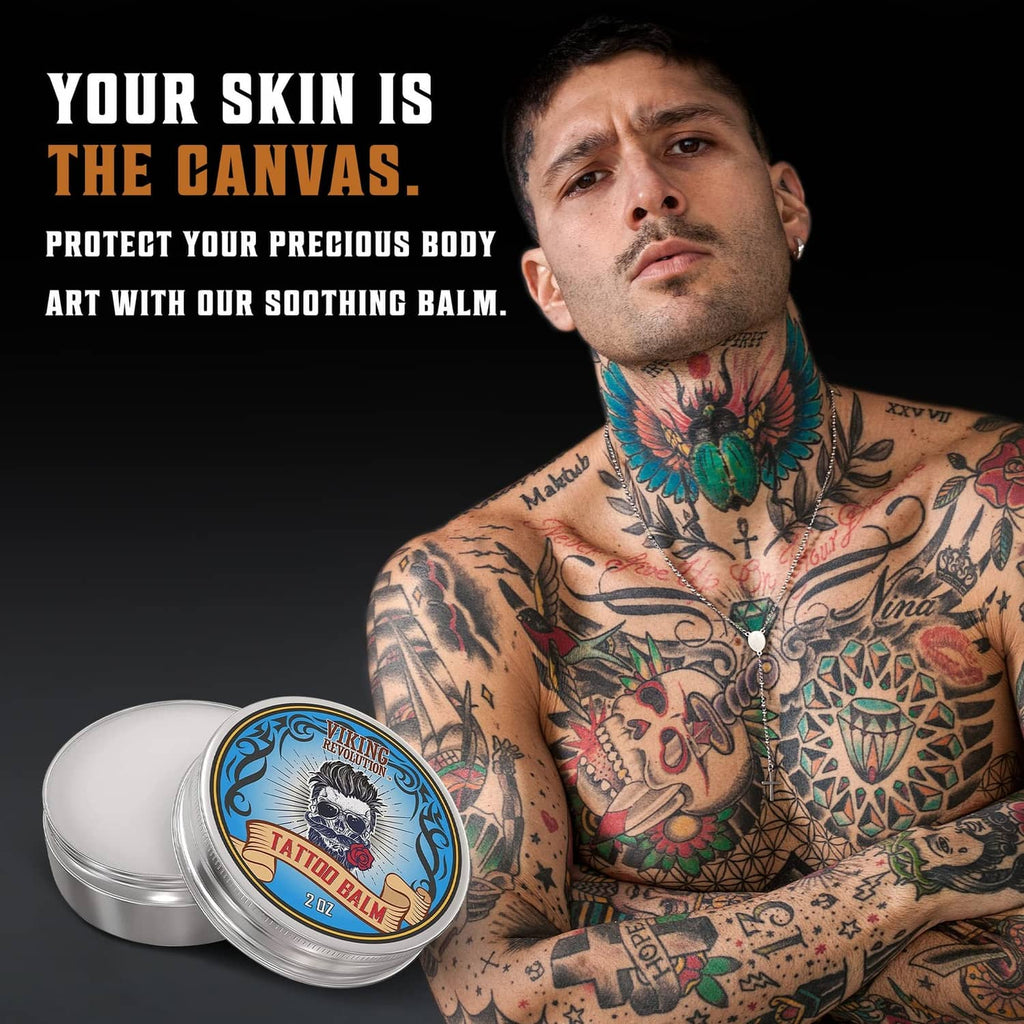 Viking Revolution tattoo care balm tins beside tattooed man, 2 oz round cans