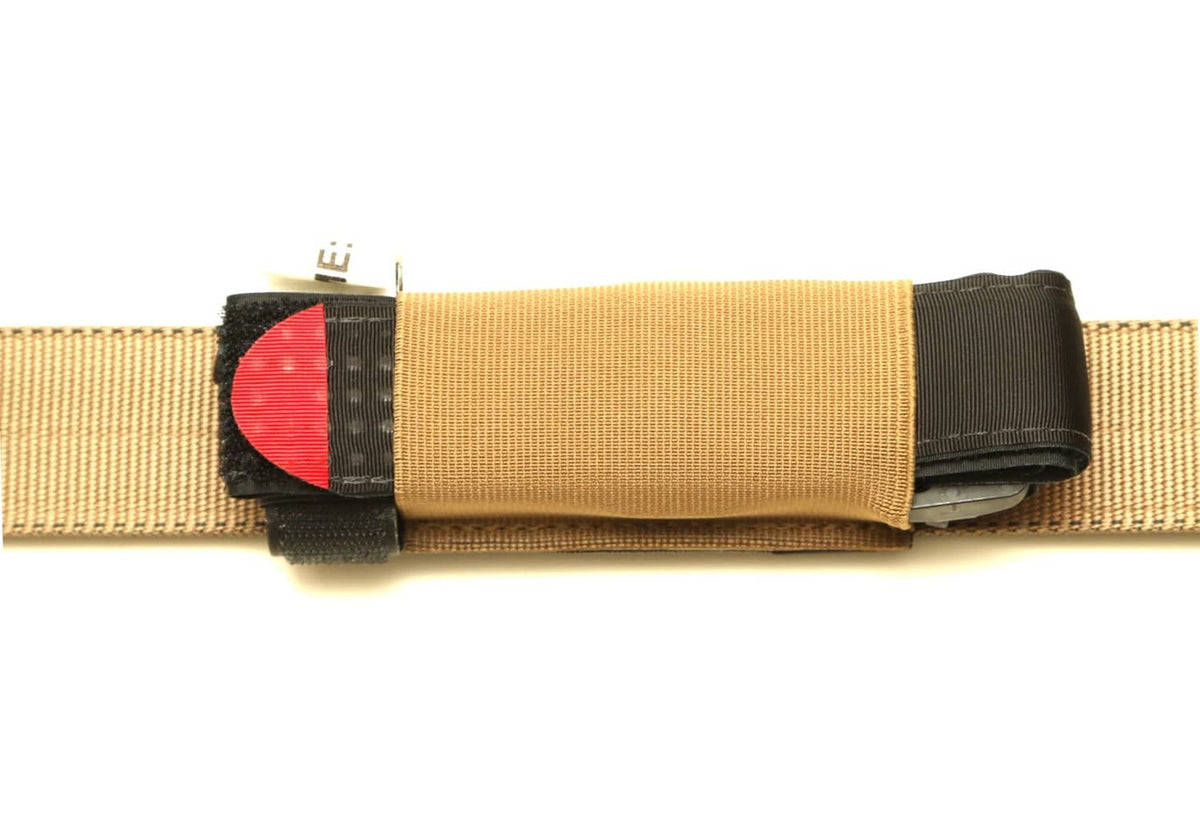 Coyote brown belt-mounted pouch with black elastic strap and red emblem