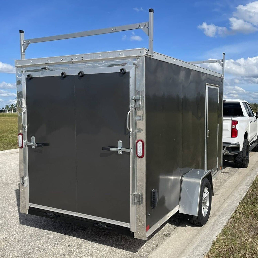 Roof mount bracket installed on enclosed trailer roof frame, white steel with black caps