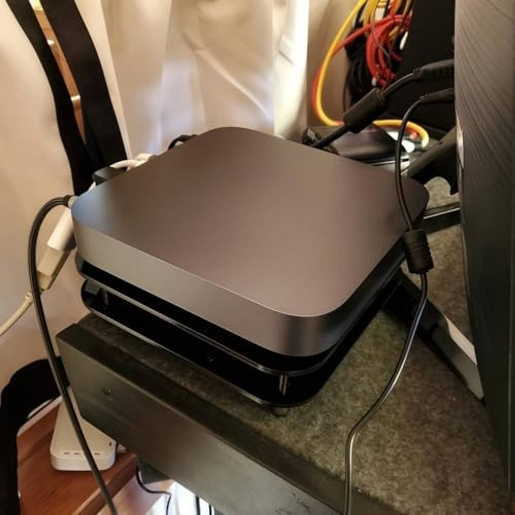 Mac mini radiator cooling fan with cables connected, matte top and black double-deck base