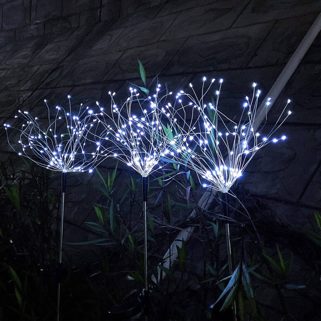Group of solar firework stake lights with cool-white LED spark bursts