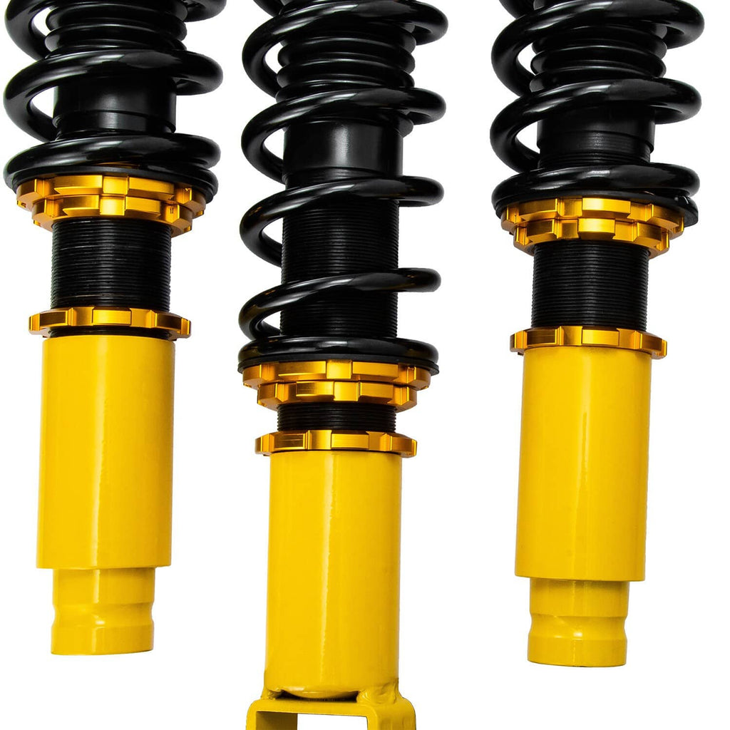 Coilover strut assembly with black spring, gold spring perch, and yellow shock body