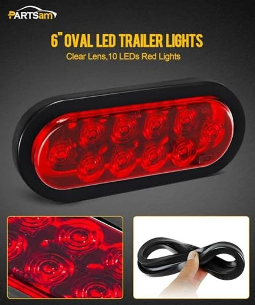 Oval red LED trailer light with clear lens and black bezel