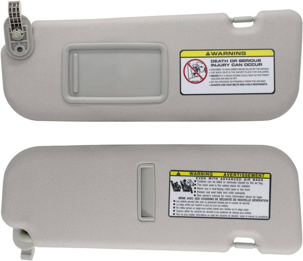 Gray sun visor showing rear side with warning label and mounting tabs