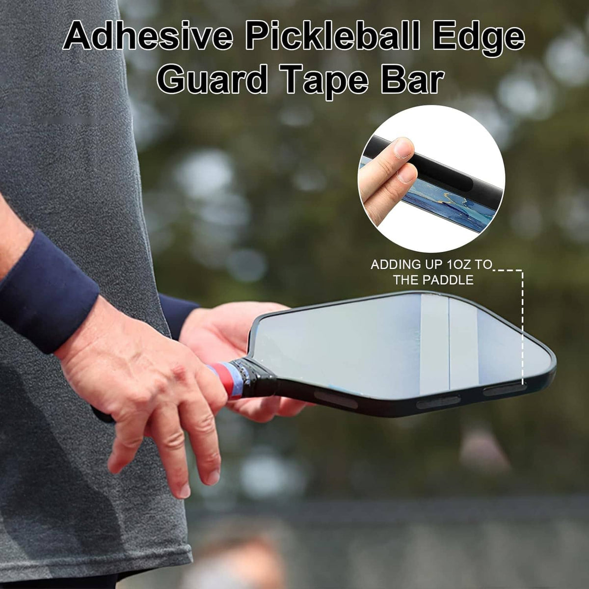 Hand applying black adhesive lead tape to the edge of a pickleball paddle.