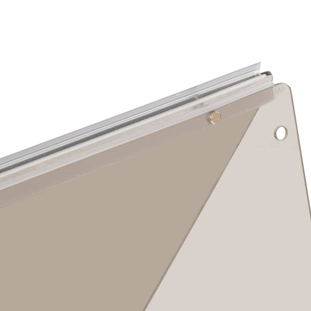 Close-up of beige tinted windshield frame rail with mounting holes
