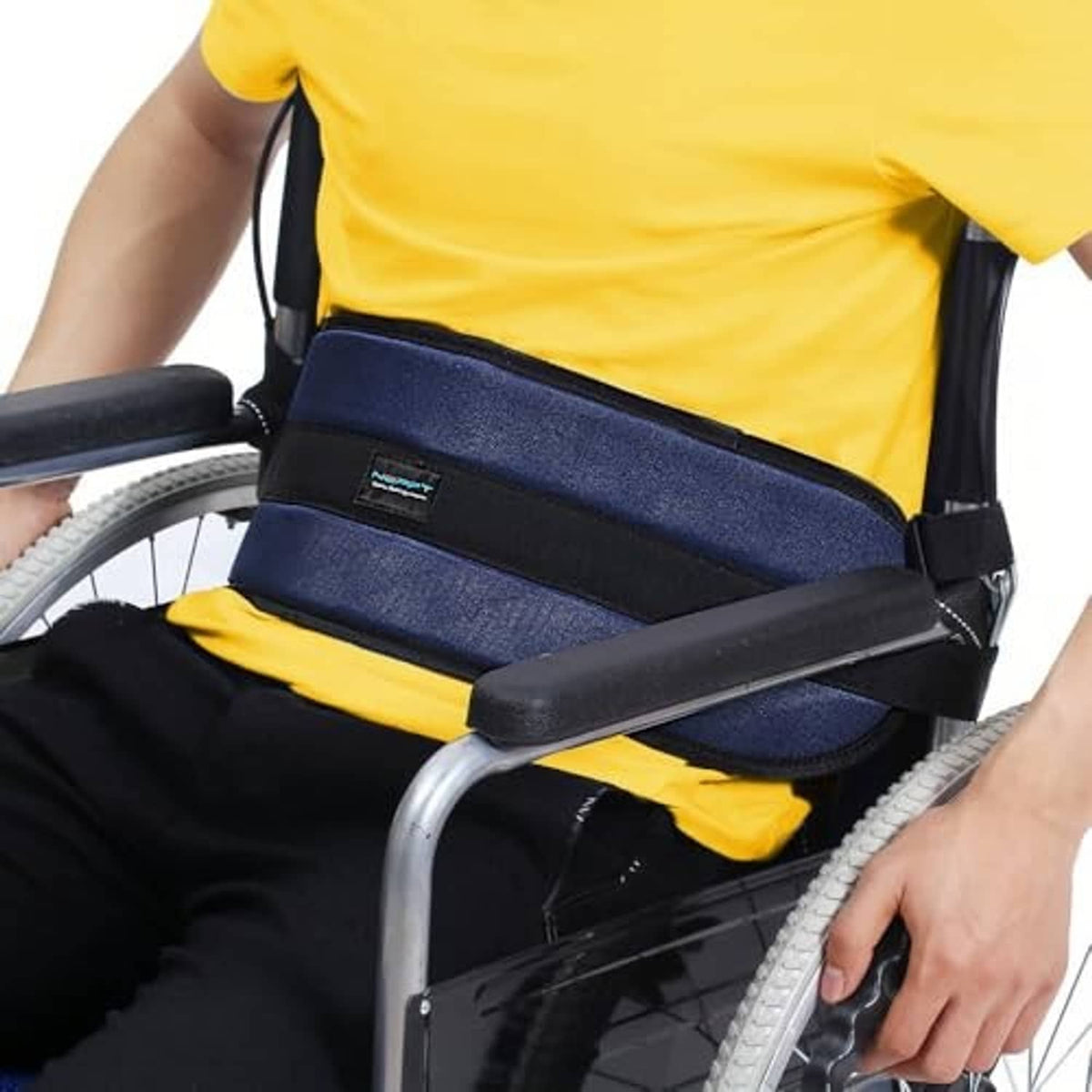 Wheelchair seatbelt restraint with wide navy padded strap and black buckle