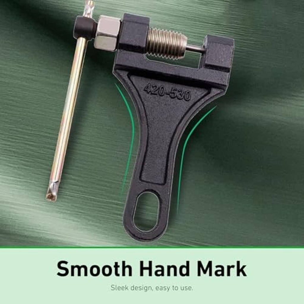 Metal chain breaker tool with 420-530 marking on black handle and threaded screw
