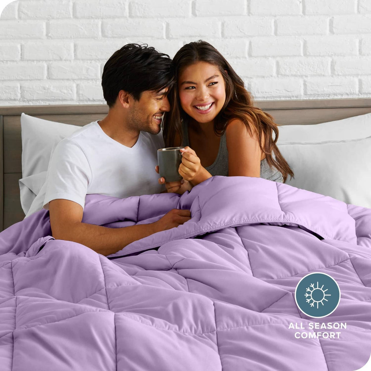 Lavender comforter set with pillow shams, layered bedding on bed