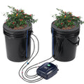 Deep water culture hydroponics system with two black buckets, pump, and tubing