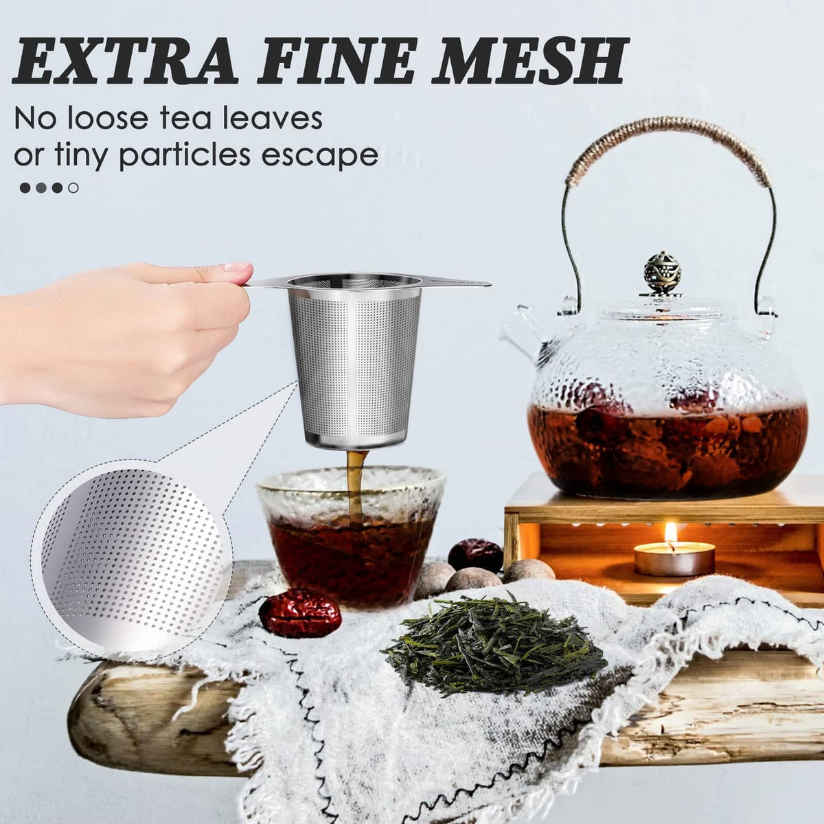 Stainless steel extra-fine mesh tea infuser, held over a cup of tea